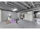 Finished basement providing great potential for recreation or storage space, with painted concrete floors at 631 E 86Th St, Indianapolis, IN 46240