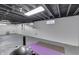 Open basement area featuring finished gray walls, flooring, and potential as a versatile space at 631 E 86Th St, Indianapolis, IN 46240