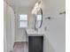 Bright bathroom featuring double vanity with oval mirrors and white shower curtain at 631 E 86Th St, Indianapolis, IN 46240