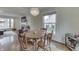 Cozy dining area open to the living room with hardwood floors at 631 E 86Th St, Indianapolis, IN 46240
