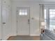 Inviting entryway with a secure smart lock, wooden floors, and ample natural light at 631 E 86Th St, Indianapolis, IN 46240