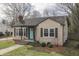 Attractive single-story home with tidy landscaping, neutral siding and a bright entry door at 631 E 86Th St, Indianapolis, IN 46240