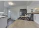 Bright kitchen featuring modern appliances, butcher block countertops, and stylish slate flooring at 631 E 86Th St, Indianapolis, IN 46240
