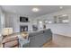 Cozy living room featuring a decorative fireplace, hardwood floors, and recessed lighting at 631 E 86Th St, Indianapolis, IN 46240