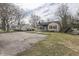 Modest home with well-kept lawn on a tree-lined street with other residences at 631 E 86Th St, Indianapolis, IN 46240