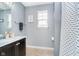 Bathroom includes a single sink vanity, shower, and an artistic wall decoration at 726 Jefferson Park Dr, Pittsboro, IN 46167