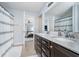 Bright bathroom features a double sink vanity, and a view into the primary bedroom at 726 Jefferson Park Dr, Pittsboro, IN 46167