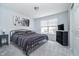 Bedroom with a black metal bed frame, bedside tables, and closet at 726 Jefferson Park Dr, Pittsboro, IN 46167