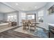 Bright dining area with a table perfect for Gathering meals, connecting seamlessly to the cozy living space at 726 Jefferson Park Dr, Pittsboro, IN 46167