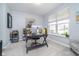 Home office features neutral paint, an oversized window, and space for desk and decor at 726 Jefferson Park Dr, Pittsboro, IN 46167