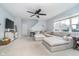 Bright living room featuring neutral paint, carpet flooring, lots of natural light, and a ceiling fan at 726 Jefferson Park Dr, Pittsboro, IN 46167