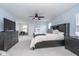 This primary bedroom is spacious with a ceiling fan and comfortable looking bed at 726 Jefferson Park Dr, Pittsboro, IN 46167