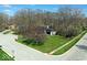 An aerial view of a landscaped property with mature trees and a long driveway at 788 S Harbour Dr, Noblesville, IN 46062