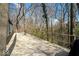 Spacious wooden backyard deck surrounded by mature trees at 788 S Harbour Dr, Noblesville, IN 46062