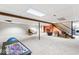 Large finished basement with carpeted floors and stairs, adjacent to laundry room at 788 S Harbour Dr, Noblesville, IN 46062