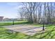 Outdoor basketball court with mature trees and a view of the surrounding community at 788 S Harbour Dr, Noblesville, IN 46062