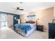 Comfortable bedroom featuring a ceiling fan, a large bed with stylish bedding, and a barn door to the en suite at 788 S Harbour Dr, Noblesville, IN 46062