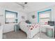 Cozy bedroom with ample natural light, featuring white walls with blue trim, plush carpet and ceiling fan at 788 S Harbour Dr, Noblesville, IN 46062