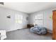 Bright bedroom with neutral gray color scheme, natural light, and carpeted floors at 788 S Harbour Dr, Noblesville, IN 46062