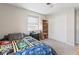 Cozy bedroom featuring a comfortable bed, built-in shelving, a closet, and large windows for natural light at 788 S Harbour Dr, Noblesville, IN 46062