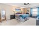 Comfortable bedroom featuring a ceiling fan, a large bed with stylish bedding, and blue curtains for a relaxing ambiance at 788 S Harbour Dr, Noblesville, IN 46062
