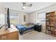 Bright bedroom features natural light from a window, neutral walls, ceiling fan, and a closet with ample storage at 788 S Harbour Dr, Noblesville, IN 46062