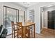 Bright dining area featuring a wooden table, sliding doors to sunroom, and a wall decor art piece at 788 S Harbour Dr, Noblesville, IN 46062