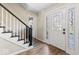 Inviting entryway with hardwood floors, decorative glass front door, and staircase at 788 S Harbour Dr, Noblesville, IN 46062