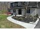 Landscaped front yard featuring a curved sidewalk, fresh mulch, and a cozy red porch swing at 788 S Harbour Dr, Noblesville, IN 46062