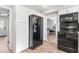 Updated kitchen featuring white cabinets, hardwood floors, and stainless steel appliances at 788 S Harbour Dr, Noblesville, IN 46062