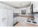 Traditional kitchen features white cabinets, wood countertops, and modern appliances at 788 S Harbour Dr, Noblesville, IN 46062