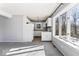 Open kitchen area with white appliances and plenty of light from large windows at 788 S Harbour Dr, Noblesville, IN 46062