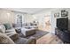 Comfortable living room featuring a large sectional sofa, neutral decor, and lots of natural light at 788 S Harbour Dr, Noblesville, IN 46062