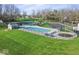 Community pool with fenced area, picnic tables, and grassy surroundings, ideal for summer fun at 788 S Harbour Dr, Noblesville, IN 46062