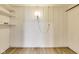 Unfinished basement offering shelving and storage with wood-look flooring at 7906 E 21St St, Indianapolis, IN 46219