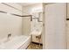 Full bathroom with a white tub, tile backsplash, and sink with vanity at 7906 E 21St St, Indianapolis, IN 46219