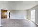 Bright living room features wood-look flooring and a large window for ample natural light at 7906 E 21St St, Indianapolis, IN 46219