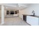 A finished basement area featuring a TV and bar area at 8228 Morel Dr, Indianapolis, IN 46256