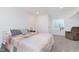 Bedroom featuring a bed, a brown chair, and a window providing natural light at 8228 Morel Dr, Indianapolis, IN 46256