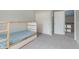 Neutral bedroom with bunk beds, closet and door to hallway, carpeted floor, and freshly painted walls at 8228 Morel Dr, Indianapolis, IN 46256