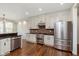 Charming kitchen features modern appliances, bright cabinets and a brick backsplash at 8228 Morel Dr, Indianapolis, IN 46256