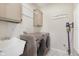 Laundry room featuring modern washer and dryer and overhead cabinets at 8228 Morel Dr, Indianapolis, IN 46256