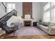 Bright living room featuring a brick fireplace, hardwood floors, and ample seating at 8228 Morel Dr, Indianapolis, IN 46256
