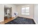 Bright living room featuring hardwood floors, large window and play area at 8228 Morel Dr, Indianapolis, IN 46256