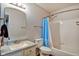 Clean bathroom with a white tiled shower and a white vanity with a grey countertop and updated mirror at 8316 S Swimming Hole Ln, Pendleton, IN 46064