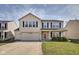Charming two-story home features a two-car garage, well-maintained lawn, and classic architectural details at 8316 S Swimming Hole Ln, Pendleton, IN 46064