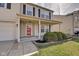 Inviting home exterior with a covered porch, neat landscaping, and a welcoming red front door at 8316 S Swimming Hole Ln, Pendleton, IN 46064