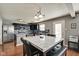 Stylish eat-in kitchen with stainless steel appliances, sleek black cabinetry, and a marble-top dining table at 8316 S Swimming Hole Ln, Pendleton, IN 46064