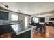Bright kitchen featuring an island, stainless steel appliances, and an open view into the adjacent living spaces at 8316 S Swimming Hole Ln, Pendleton, IN 46064