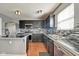 Modern kitchen with stainless steel appliances, stylish backsplash, and sleek black cabinetry at 8316 S Swimming Hole Ln, Pendleton, IN 46064